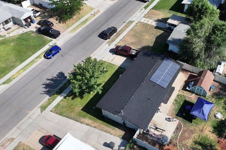 Drone view of a Northern Utah home with a light shingle roof. The NuRoof Guys.