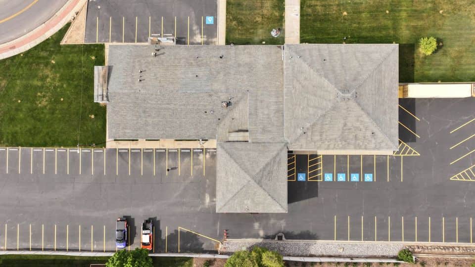 The same commercial asphalt shingle roof after GoNano restoration treatment.