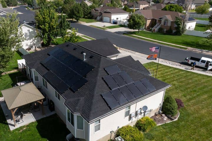 Aerial view of a Northern Utah roof with solar panels. The NuRoof Guys.
