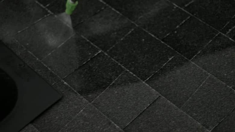 Slow-motion spray around a roof pipe boot. The NuRoof Guys.